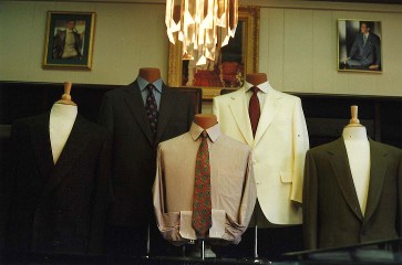 Suits under chandelier 